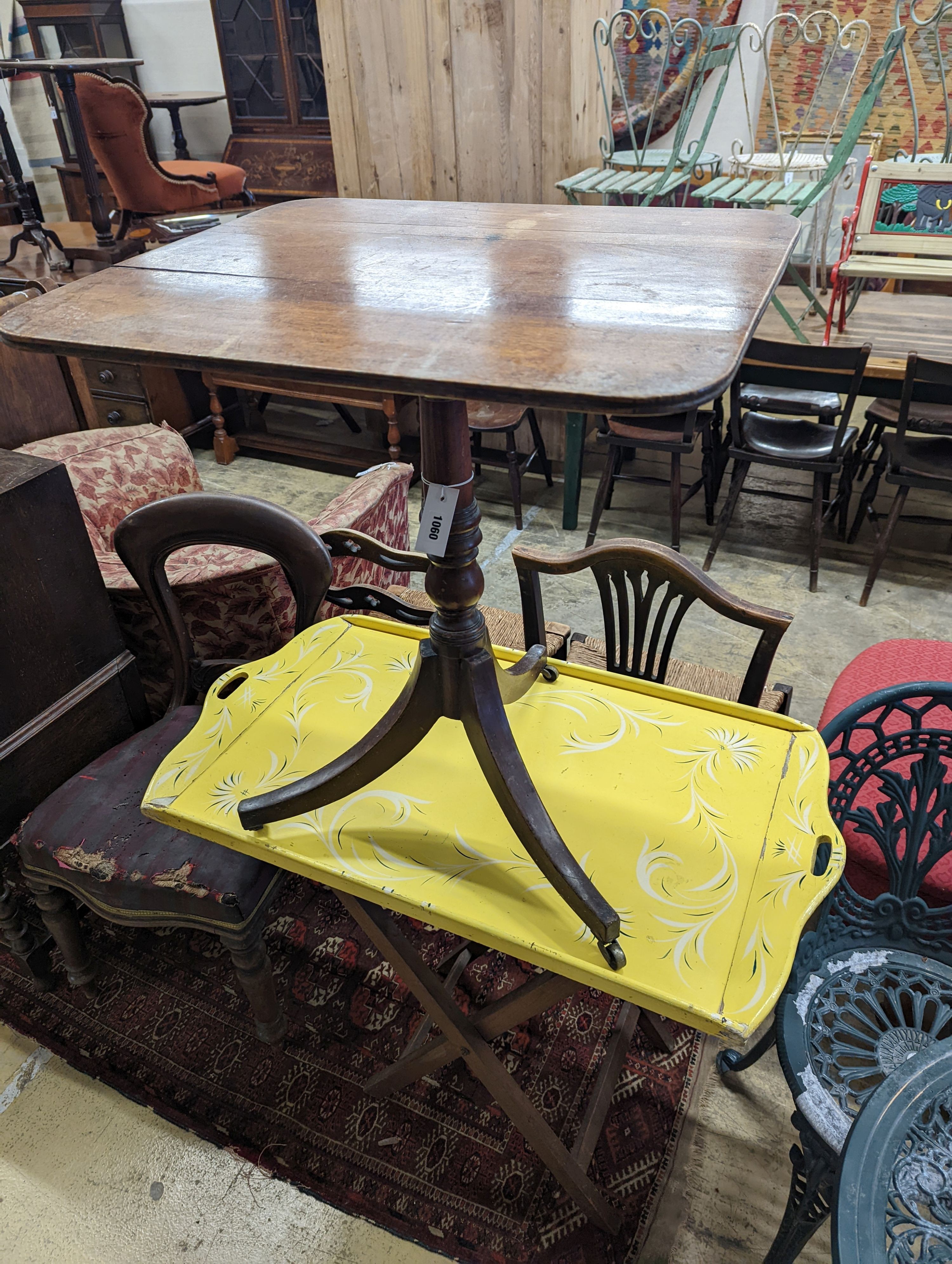 An early 19th century mahogany tripod wine table, two provincial rush seat chairs and one other and a butler's tray